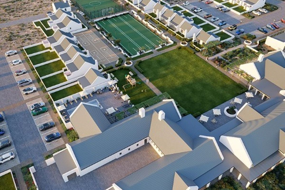 Aerial view of a modern residential estate featuring multiple housing units, communal sports facilities, a swimming pool, and landscaped green spaces.