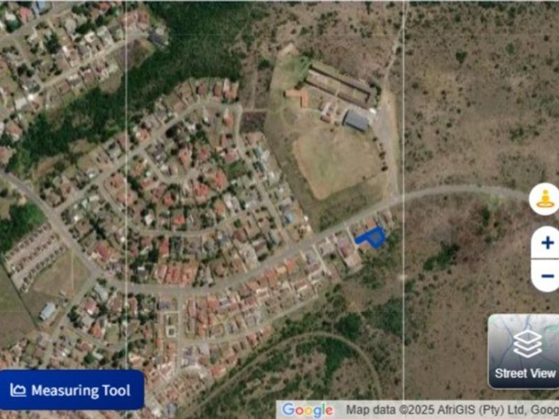 An aerial satellite view showing the location of the vacant residential plot within the surrounding neighborhood context.