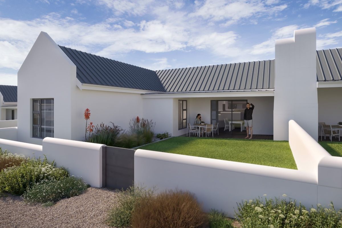 A modern rear exterior view featuring a covered patio, manicured lawn, and clean white architectural lines with a durable metal roof.