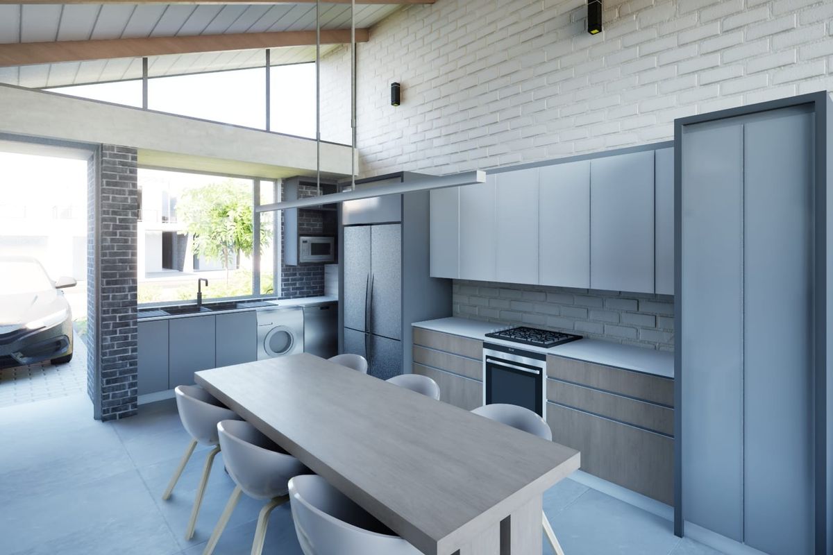 Modern open-plan kitchen and dining area featuring sleek cabinetry, built-in appliances, exposed brick walls, and high vaulted ceilings with clerestory windows.