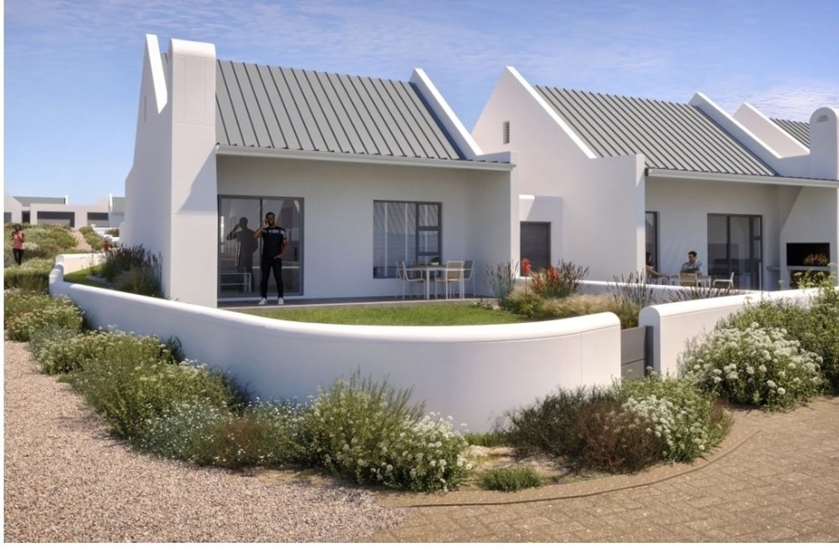Modern residential unit featuring a metal roof, covered patio with built-in braai, and a private landscaped garden area.