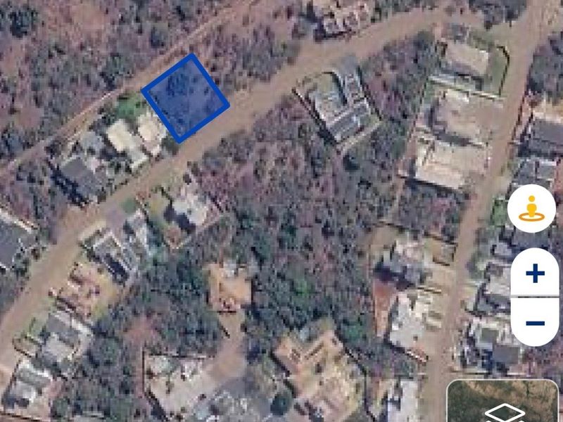 An aerial satellite view showing the location and boundaries of the vacant residential land plot within the neighborhood.