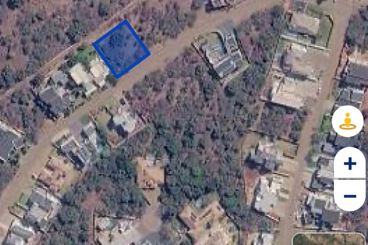 An aerial satellite view showing the location and boundaries of the vacant residential land plot within the neighborhood.