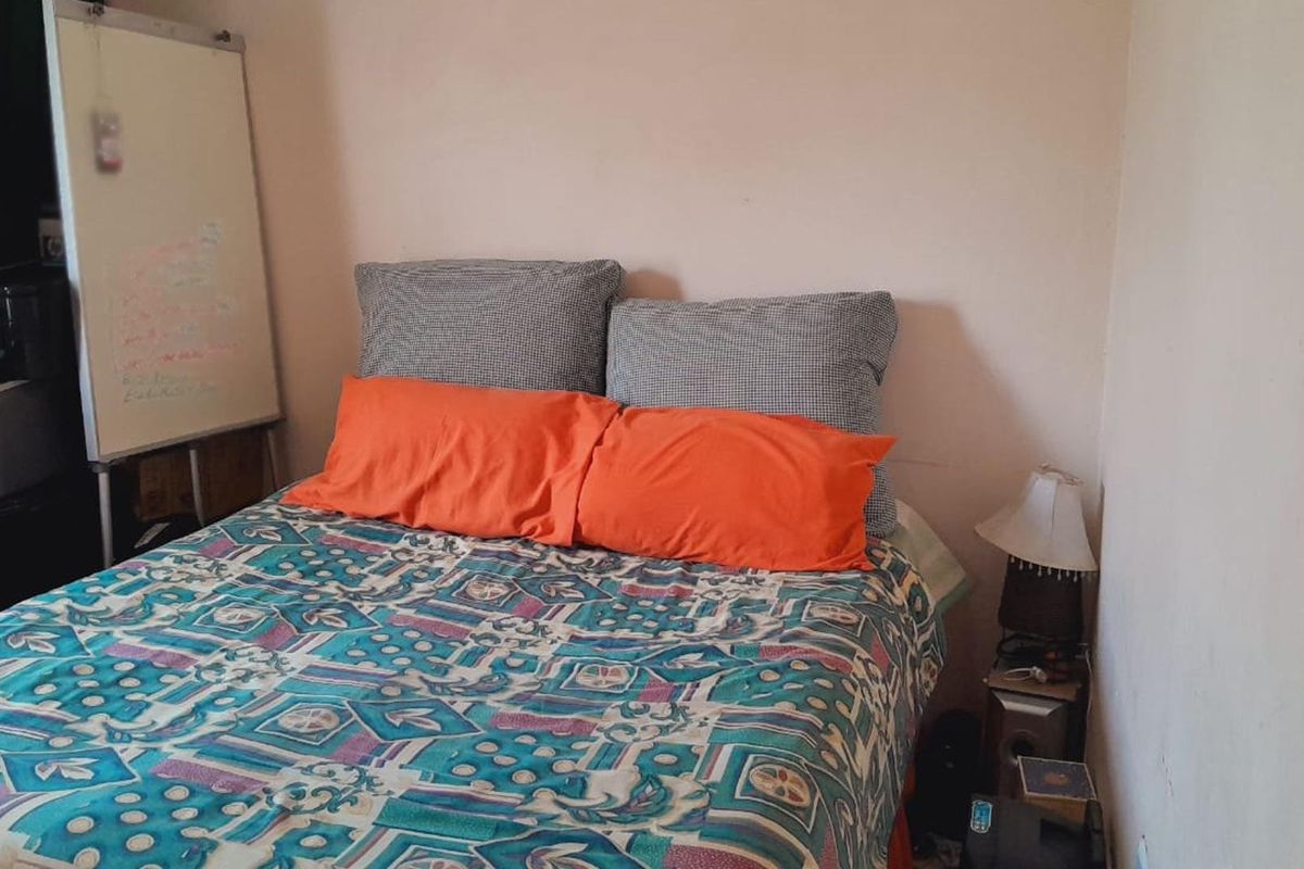 A standard bedroom space featuring neutral wall finishes, suitable for a variety of interior design styles.