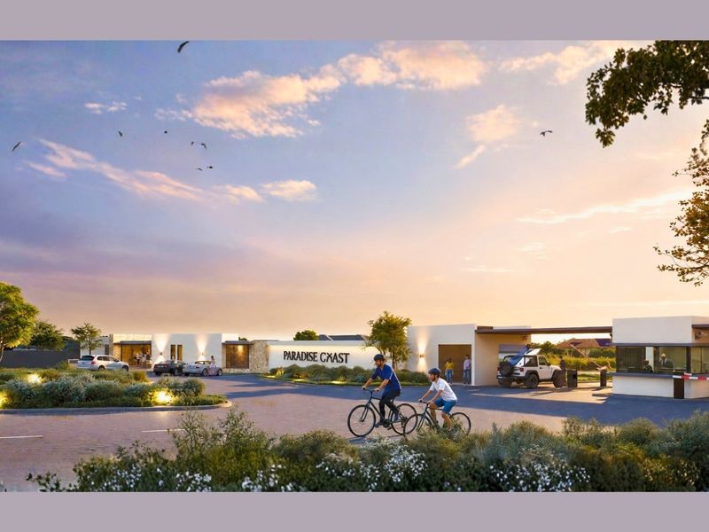 A professional architectural rendering of the Paradise Coast residential estate entrance, featuring a modern security gatehouse, paved access road, and landscaped surroundings.