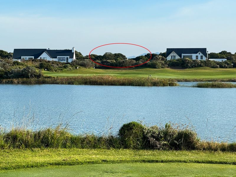 A scenic view of a lake and golf course landscape, highlighting the natural surroundings and proximity to established residential properties.