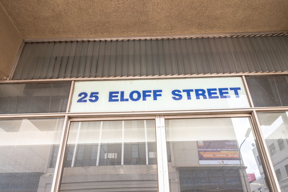 Front facade of the commercial property located at 25 Eloff Street, featuring large glass display windows and prominent building signage.