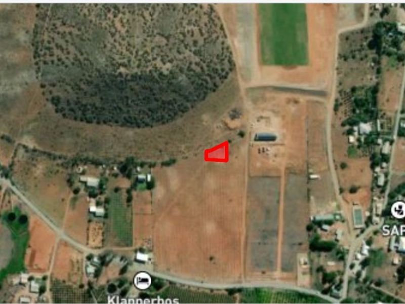 An aerial satellite view showing the location of the vacant residential land plot within the surrounding neighborhood.