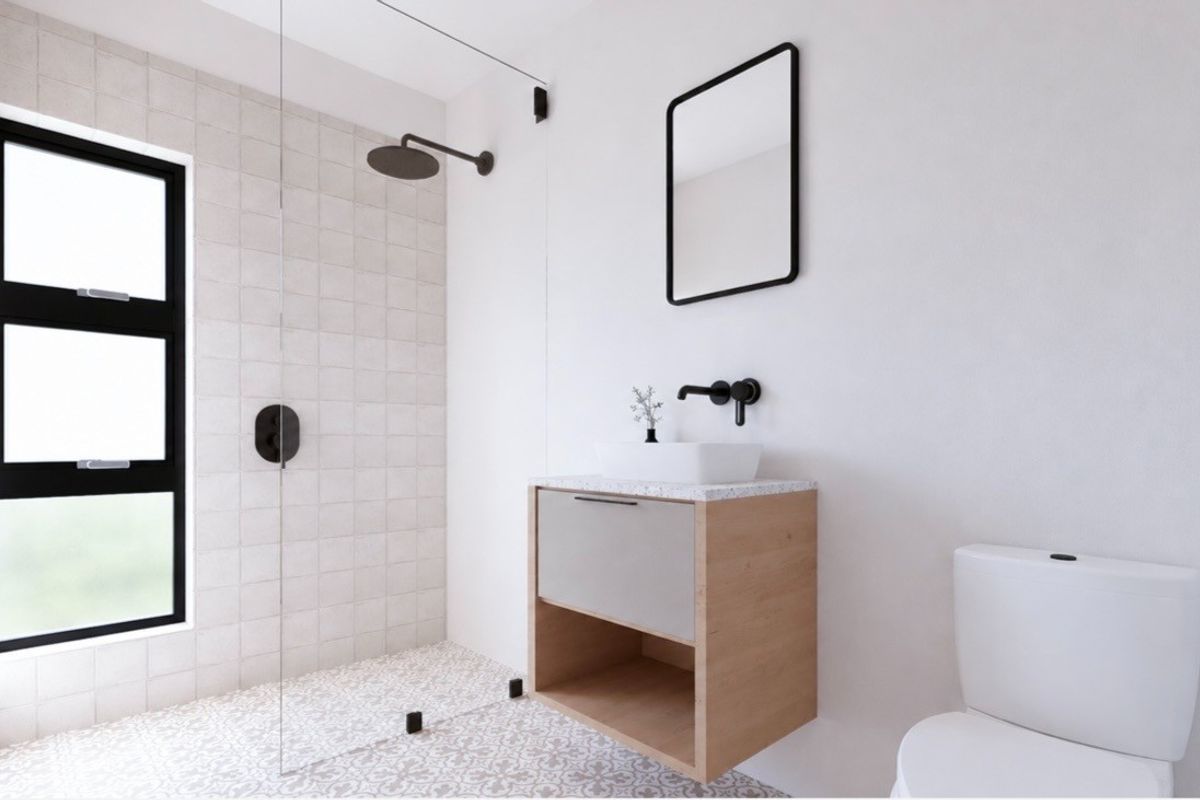 Modern bathroom featuring a walk-in shower with glass screen, wall-mounted vanity with vessel sink, and contemporary black matte fixtures.