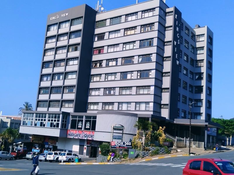Exterior view of King's View apartment building featuring a multi-story residential structure with commercial retail units located on the ground floor.