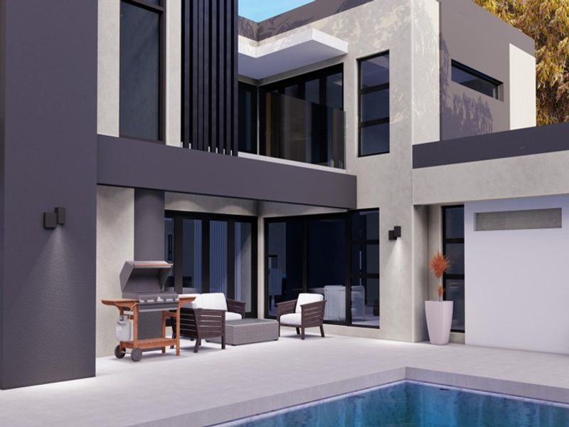 Modern rear exterior featuring a tiled patio area, swimming pool, and contemporary architectural design with large glass windows and doors.