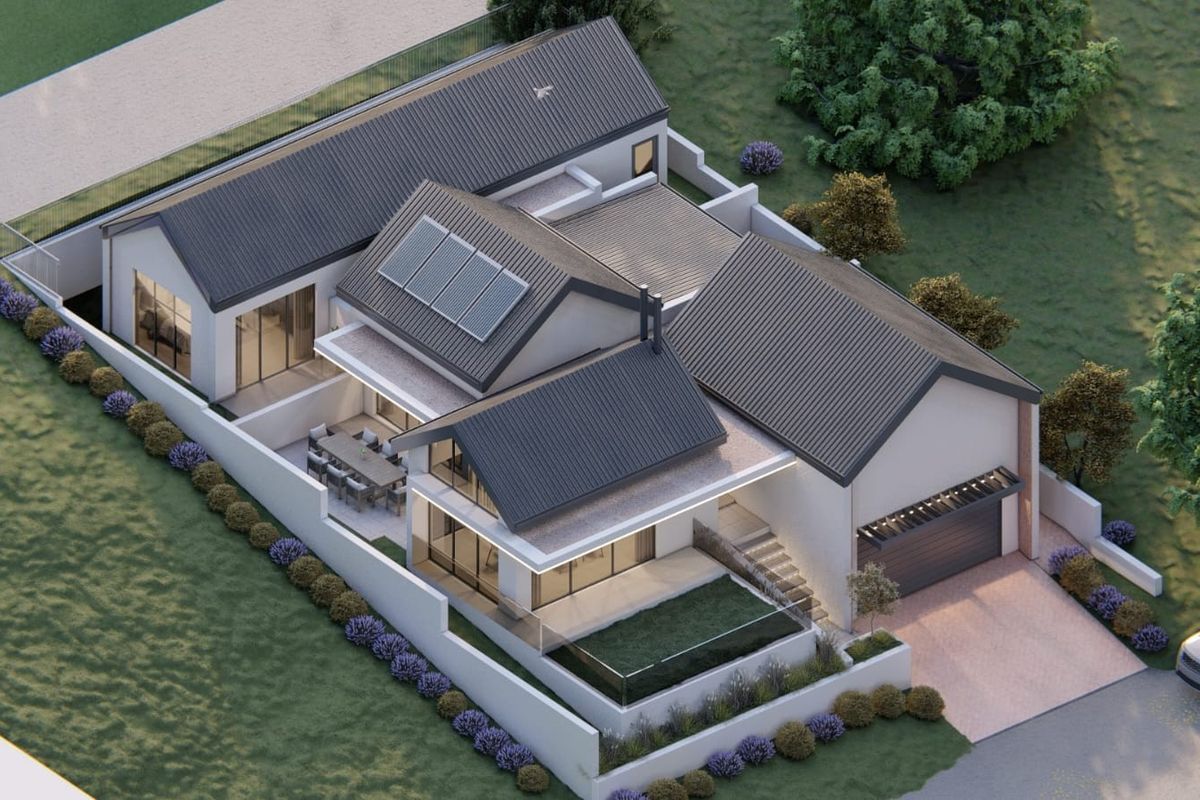 An aerial perspective of a modern residential property featuring a pitched roof, integrated solar panels, a private garage, and landscaped boundary walls.