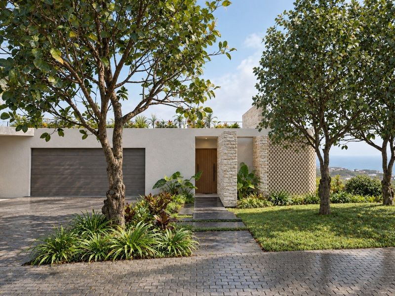 Modern architectural front facade featuring stone cladding, a double garage, and a beautifully landscaped garden with a paved driveway.