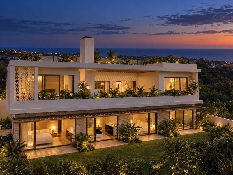 A stunning modern multi-level residence featuring expansive glass sliding doors, stone accents, a rooftop terrace, and beautifully landscaped gardens at twilight.