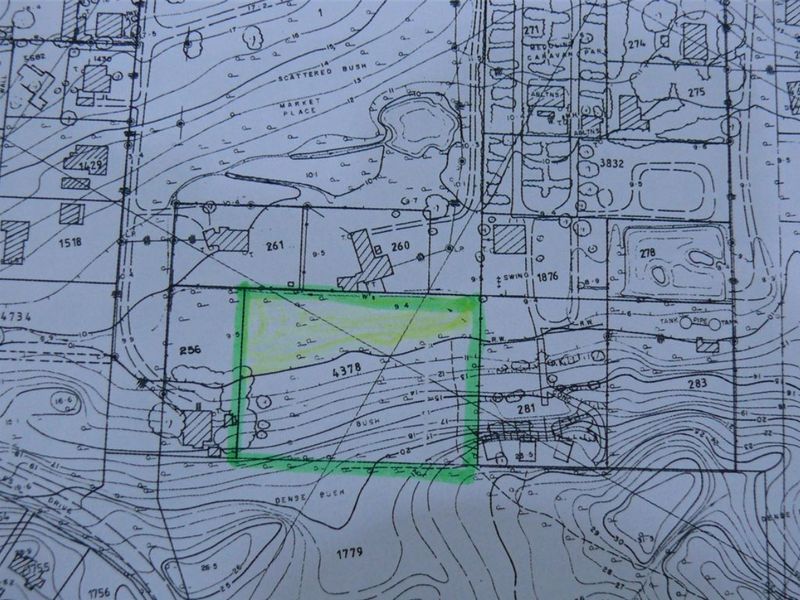 A topographical survey map highlighting a specific residential land plot within the broader site layout.