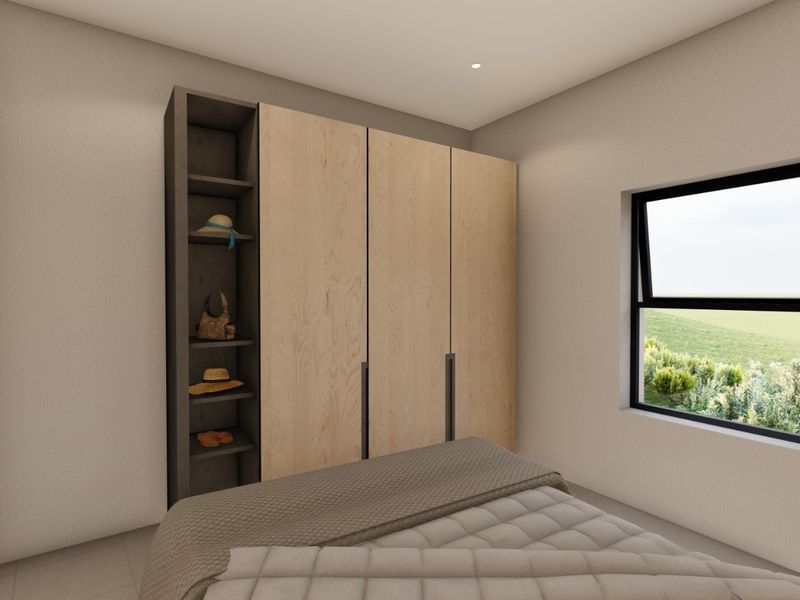 A modern bedroom featuring a sleek built-in wardrobe with integrated shelving and a large casement window providing natural light and scenic views.
