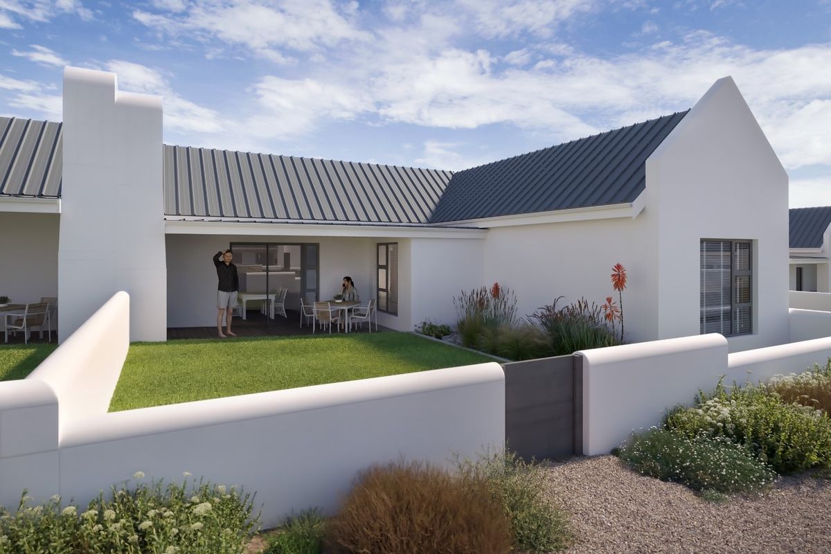 A modern rear exterior view featuring a covered patio, metal roofing, and a well-maintained garden with a boundary wall.