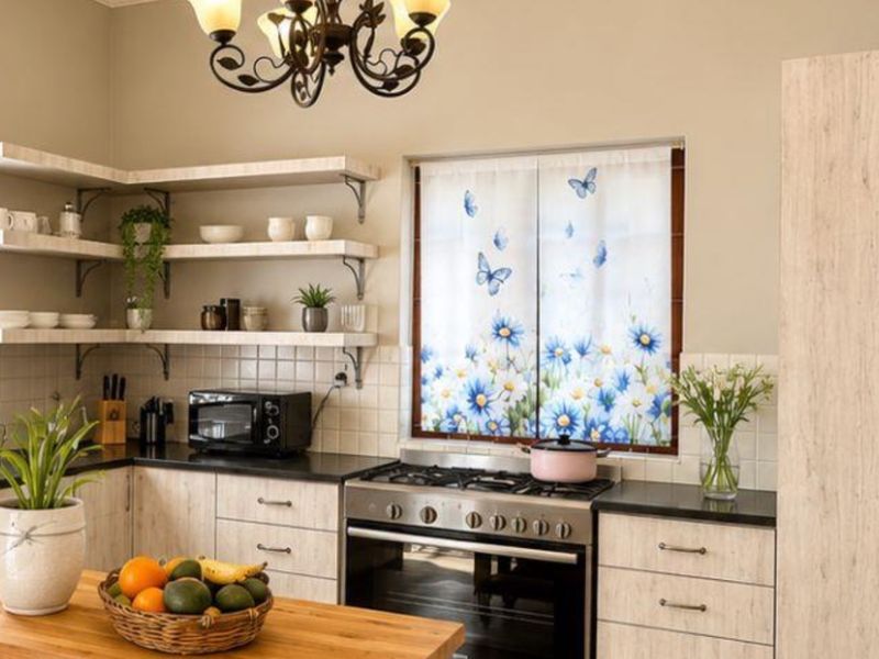 A functional kitchen featuring light wood-look cabinetry, open shelving, a tiled backsplash, and a built-in gas stove with oven.