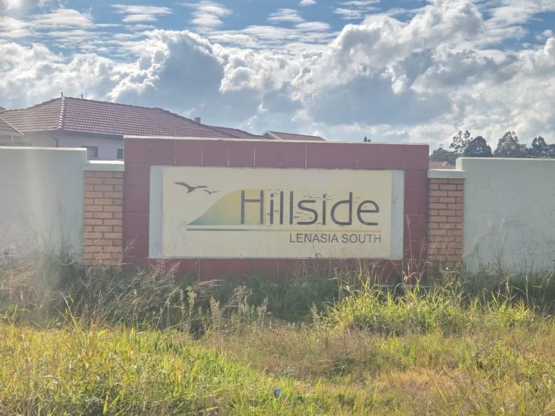 Entrance signage for Hillside estate in Lenasia South, featuring a brick and plaster boundary wall structure.