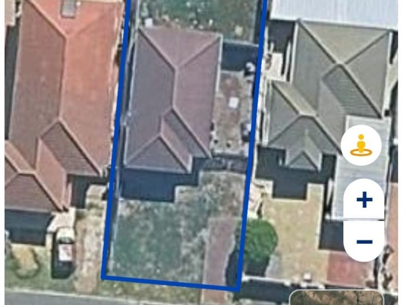 Aerial satellite view of the townhouse property showing the building footprint, roof structure, and surrounding yard space.