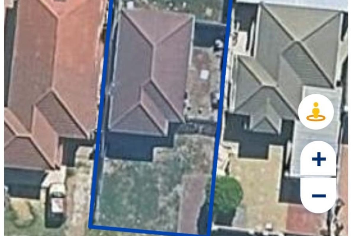 Aerial satellite view of the townhouse property showing the building footprint, roof structure, and surrounding yard space.