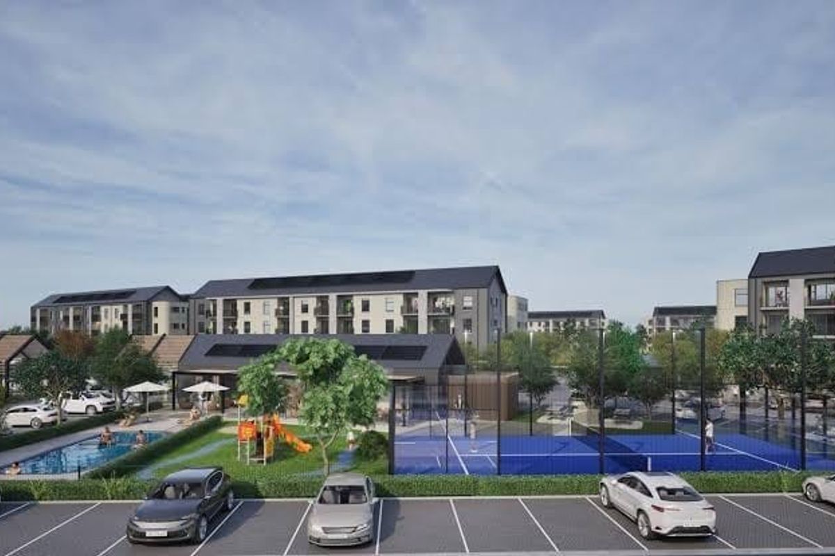 An aerial view of a modern apartment complex featuring a swimming pool, tennis court, playground, and ample parking facilities.