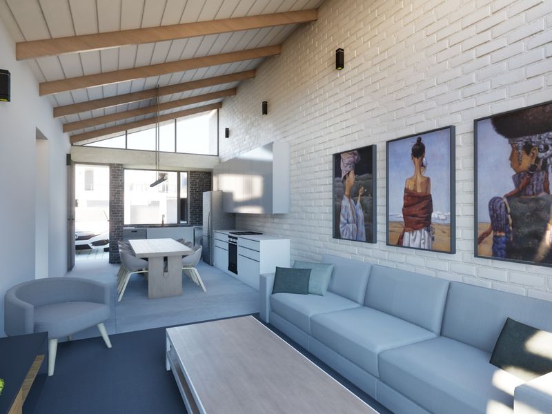 Modern open-plan living and kitchen area featuring exposed timber beams, painted brick walls, and sleek built-in cabinetry with integrated appliances.