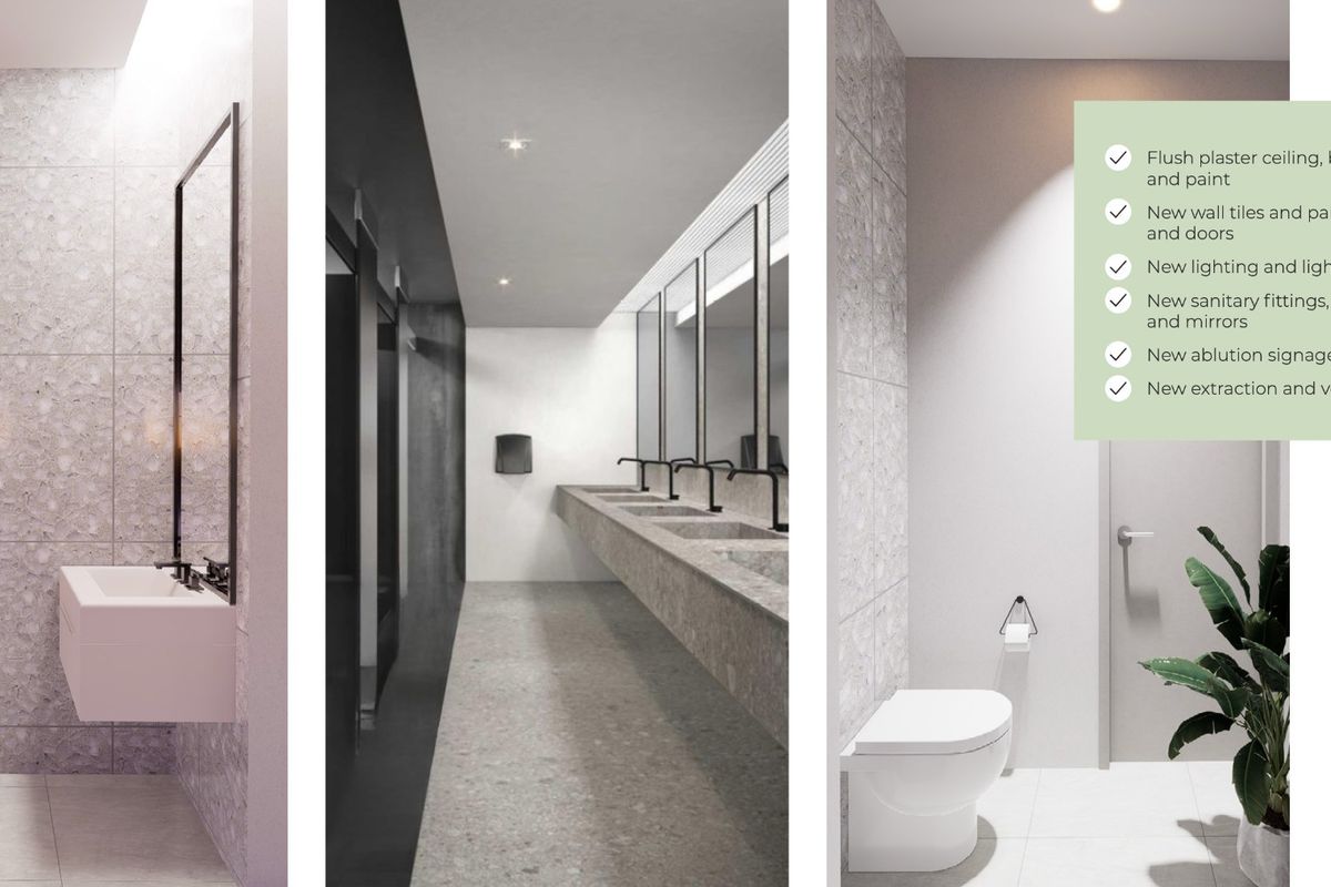Modern commercial bathroom featuring high-end finishes, including stone-look wall tiles, wall-mounted vanities, integrated mirrors, and contemporary sanitary fittings with professional lighting.