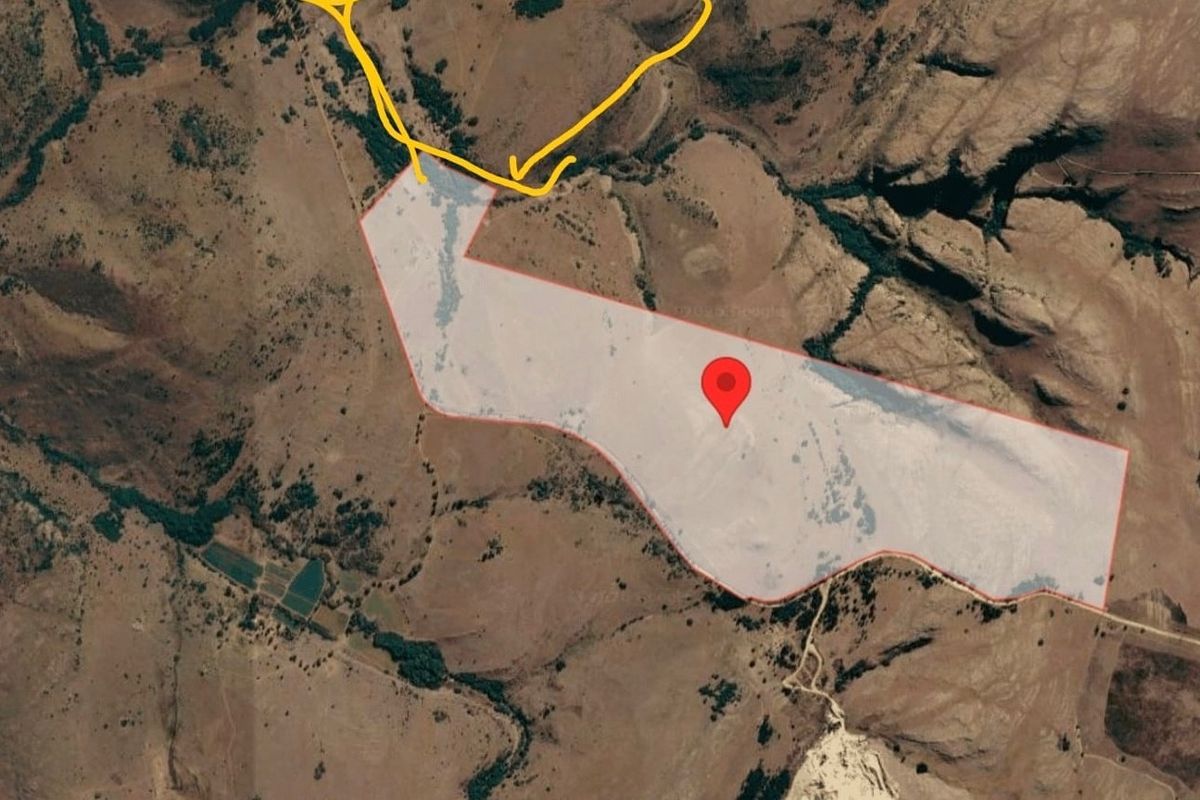 An aerial satellite view showing the topography and land boundaries of the property.