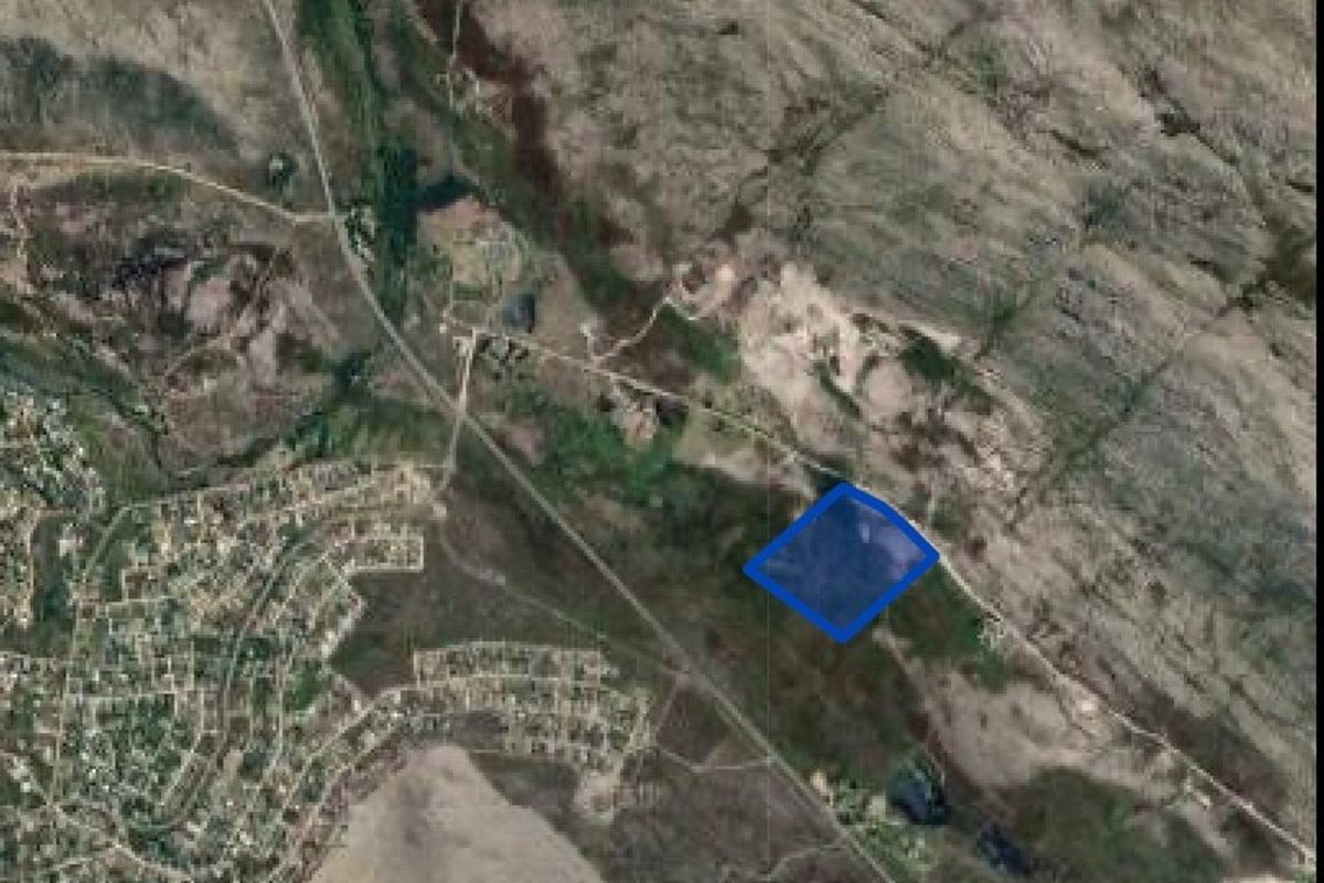 An aerial satellite view showing the location of the small holding property within the surrounding landscape.