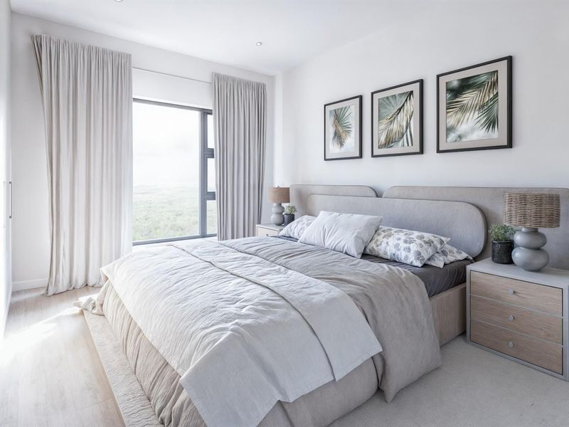 A bright and modern bedroom featuring built-in cupboards, recessed lighting, and a large window with natural light.