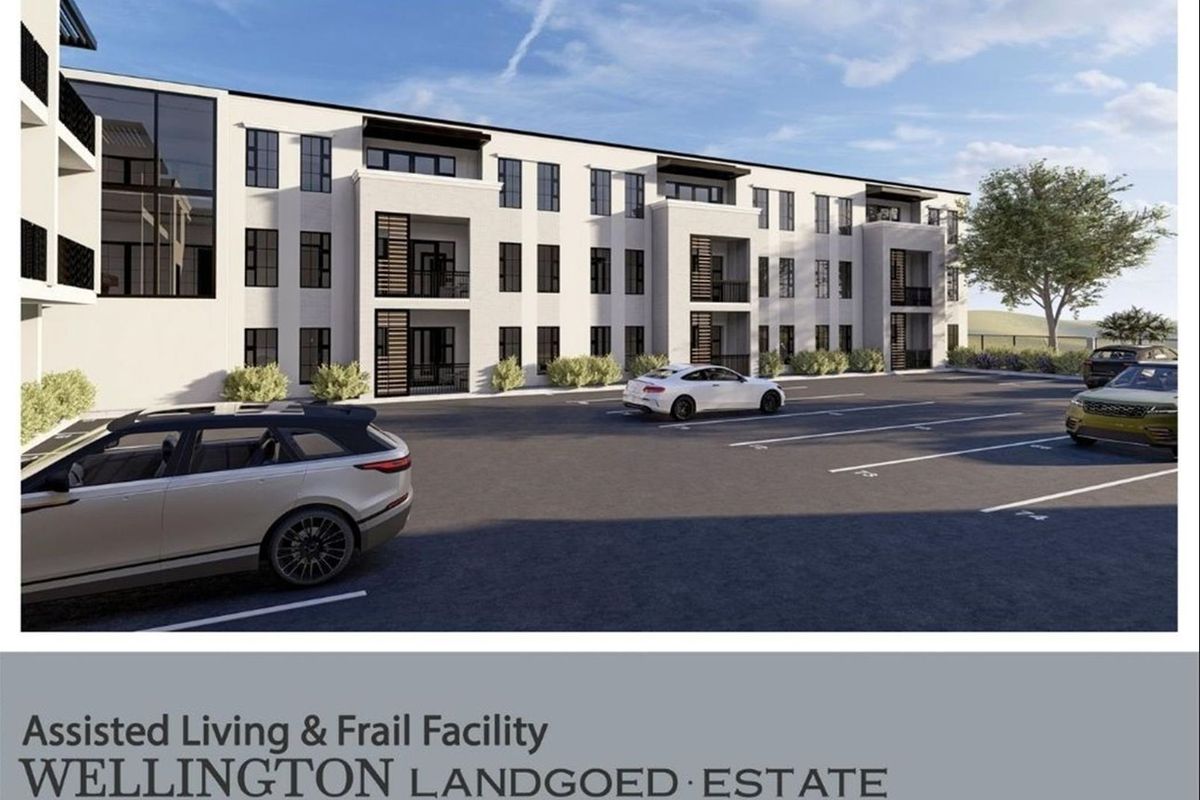 A digital architectural rendering of the Wellington Landgoed Estate assisted living and frail care facility, featuring a modern multi-story building and paved parking area.
