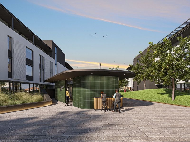 A modern office courtyard featuring a green tiled kiosk, paved walkways, and landscaped green spaces between contemporary office buildings.