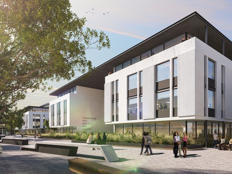 Modern office building exterior featuring a textured white facade, large glass windows, and a well-designed paved plaza with integrated seating and landscaping.