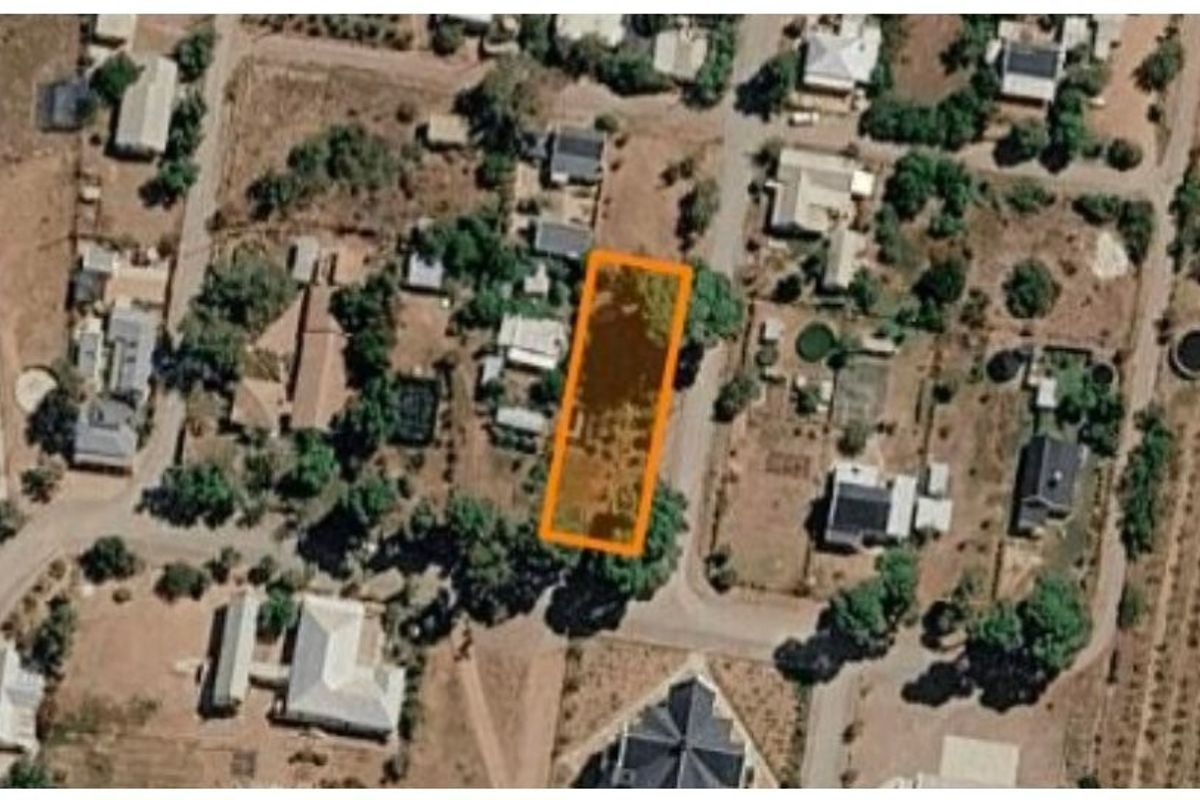 An aerial view showing the residential vacant land plot highlighted in orange within the surrounding neighborhood context.