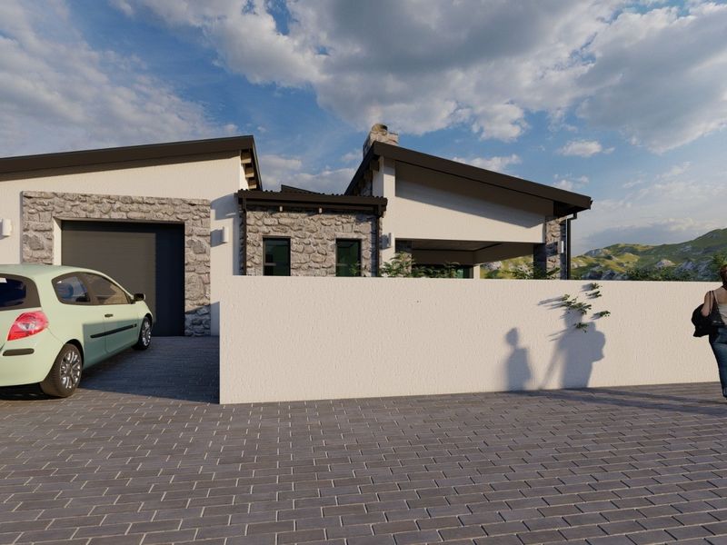 Front elevation of a modern residential property featuring stone cladding, a paved driveway, and a secure garage.