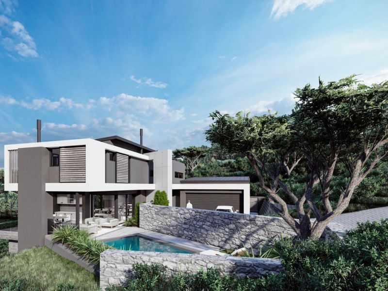 Modern architectural home featuring a swimming pool, stone retaining walls, and a spacious covered patio area set within a landscaped environment.