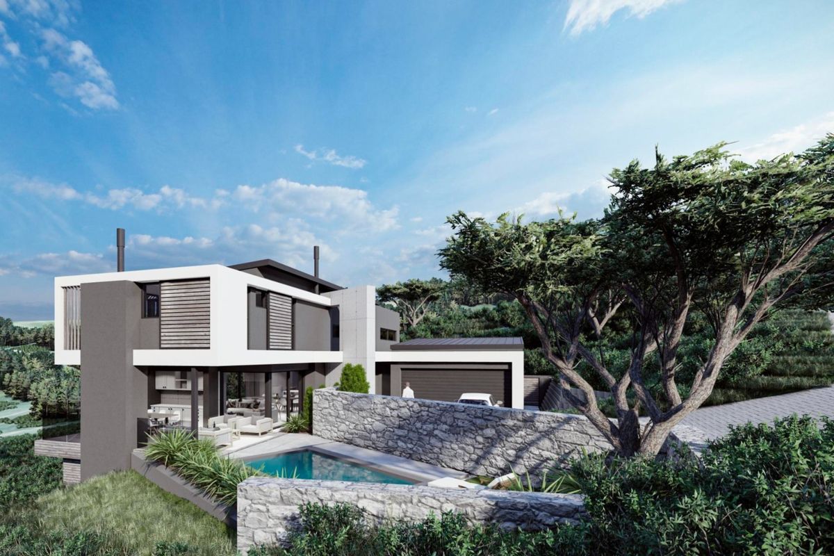 Modern architectural home featuring a swimming pool, stone retaining walls, and a spacious covered patio area set within a landscaped environment.