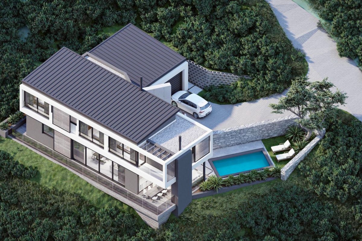 Aerial view of a modern multi-level residence featuring a swimming pool, paved driveway, and contemporary architectural design set within a landscaped environment.