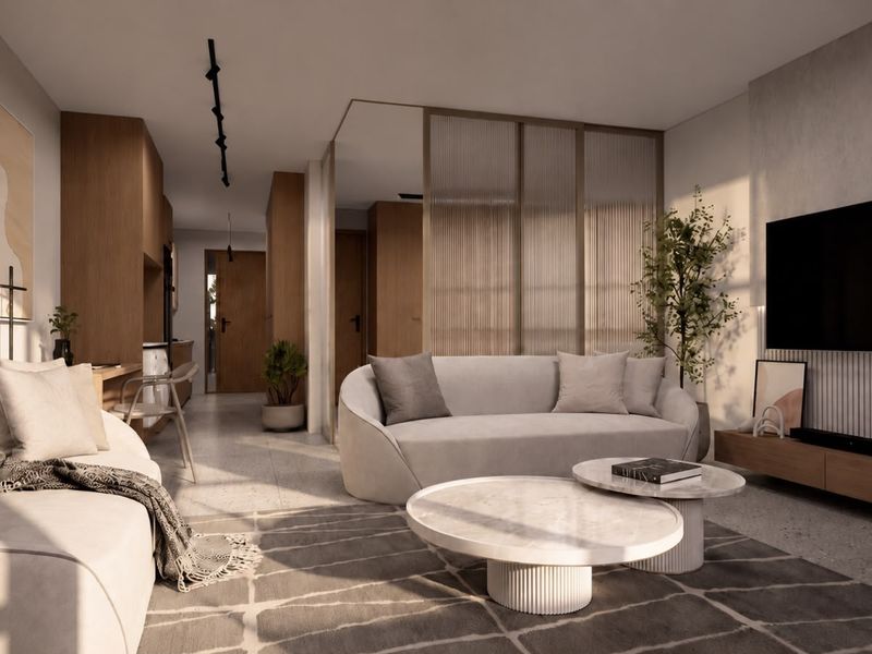 Modern open-plan living area featuring high-end finishes, terrazzo flooring, and a stylish fluted glass partition, creating a sophisticated and well-lit interior space.