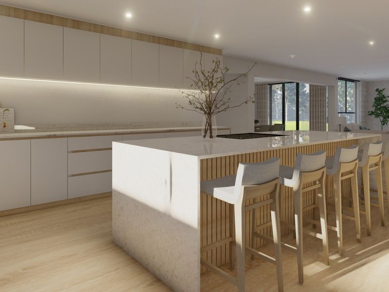 Modern open-plan kitchen featuring a large stone-topped island, sleek cabinetry, and integrated appliances, seamlessly flowing into the living area with timber flooring.