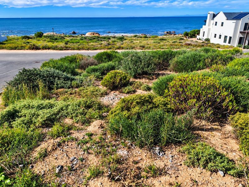 A scenic view of the coastal landscape and ocean from the vacant residential property.