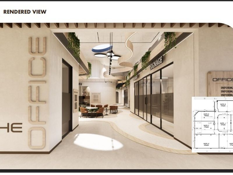 A modern office lobby area featuring glass partitions, contemporary ceiling design, and integrated signage, presented as a professional architectural rendering.