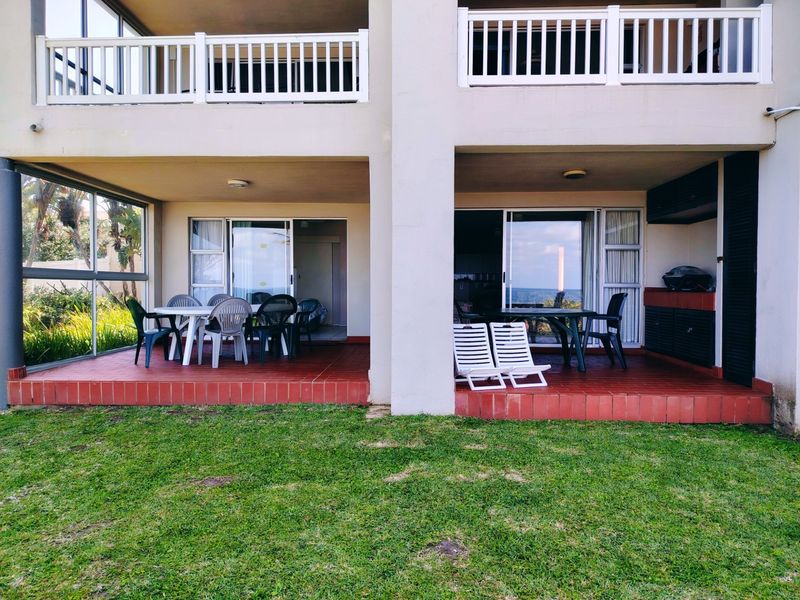 Ground floor patio area featuring tiled flooring, built-in cabinetry, and sliding glass door access to the interior living space.