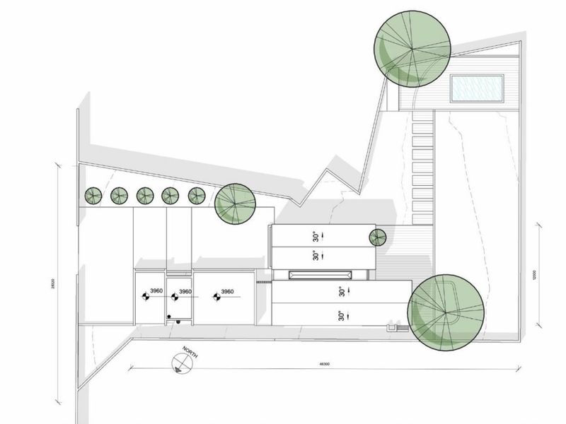Architectural site plan showing the layout of the residential property, including building footprint, outdoor areas, and landscaping.
