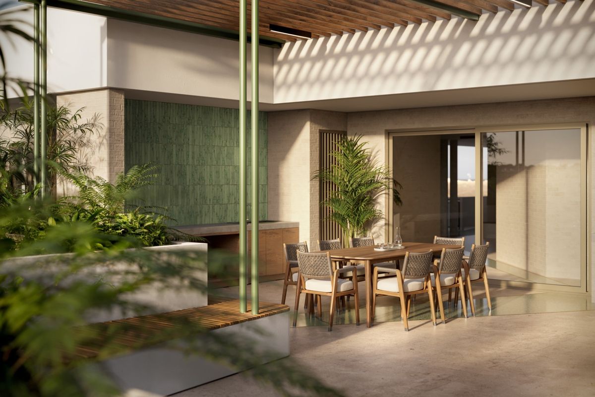A modern covered patio featuring a timber pergola, built-in outdoor kitchen, and seamless access to the interior through large sliding glass doors.