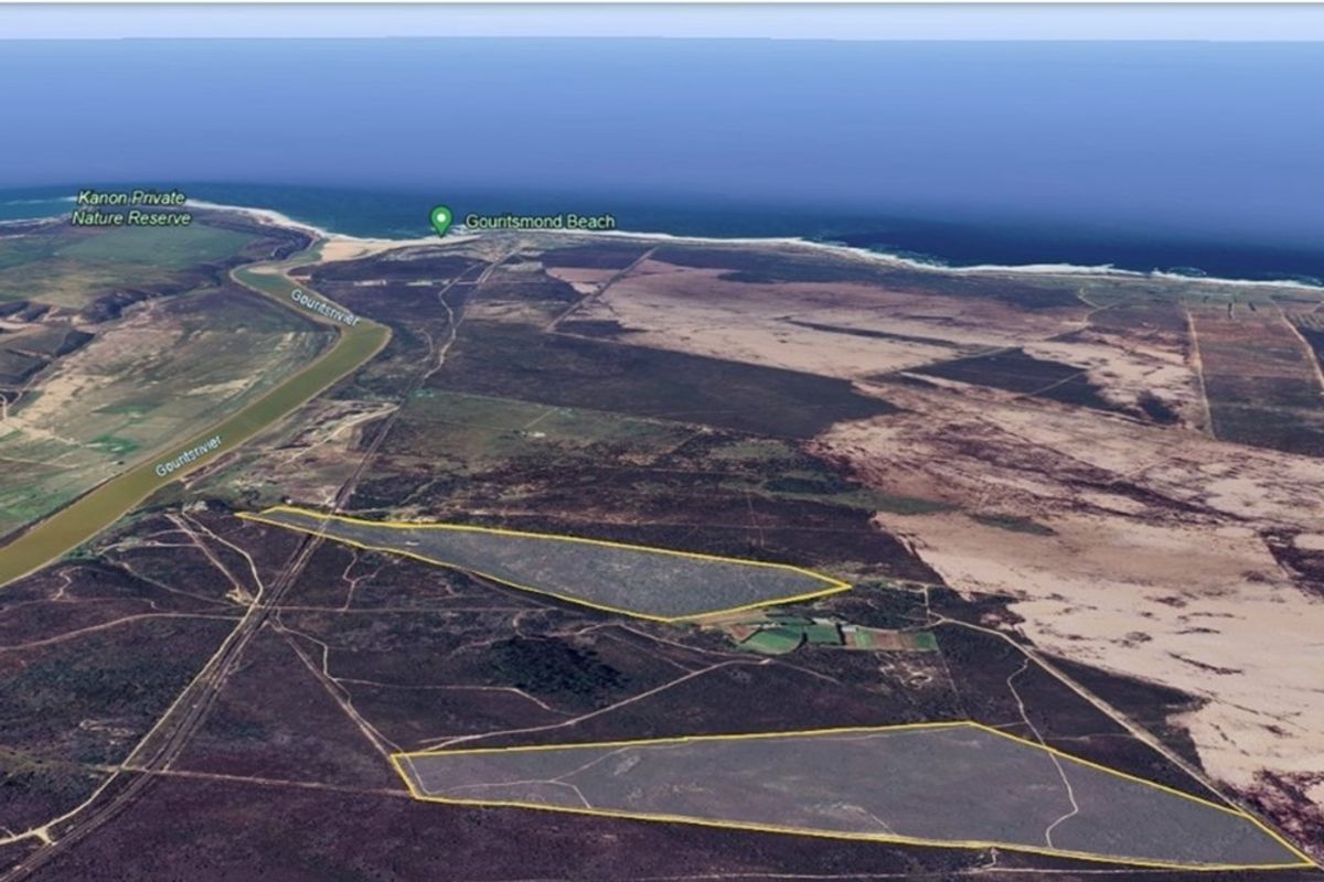 Aerial view of the farm property highlighting its expansive land, proximity to the river, and coastal location near Gouritsmond Beach.