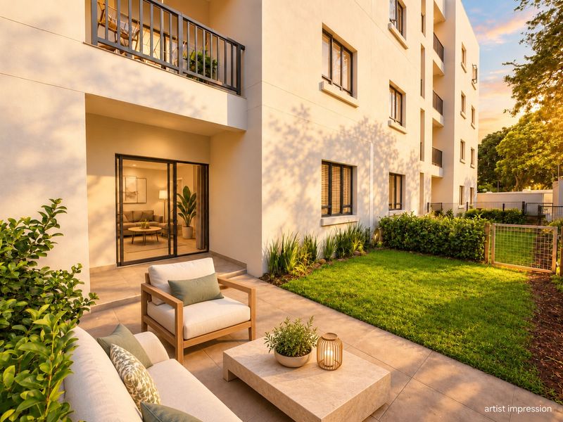 A modern ground-floor apartment featuring a private tiled patio, landscaped garden, and seamless indoor-outdoor flow through large sliding glass doors.