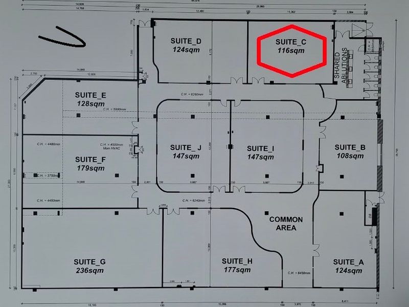 A detailed architectural floor plan of the office building, highlighting Suite C with a red border and showing the layout of various suites.