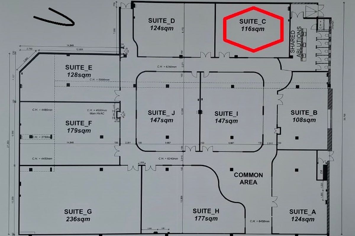 A detailed architectural floor plan of the office building, highlighting Suite C with a red border and showing the layout of various suites.